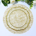 Gold decorative plate on a patterned table setting.