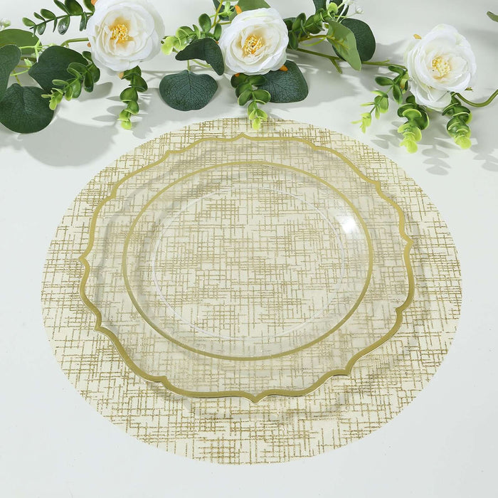Clear decorative plate on a textured gold and cream placemat with floral accents.