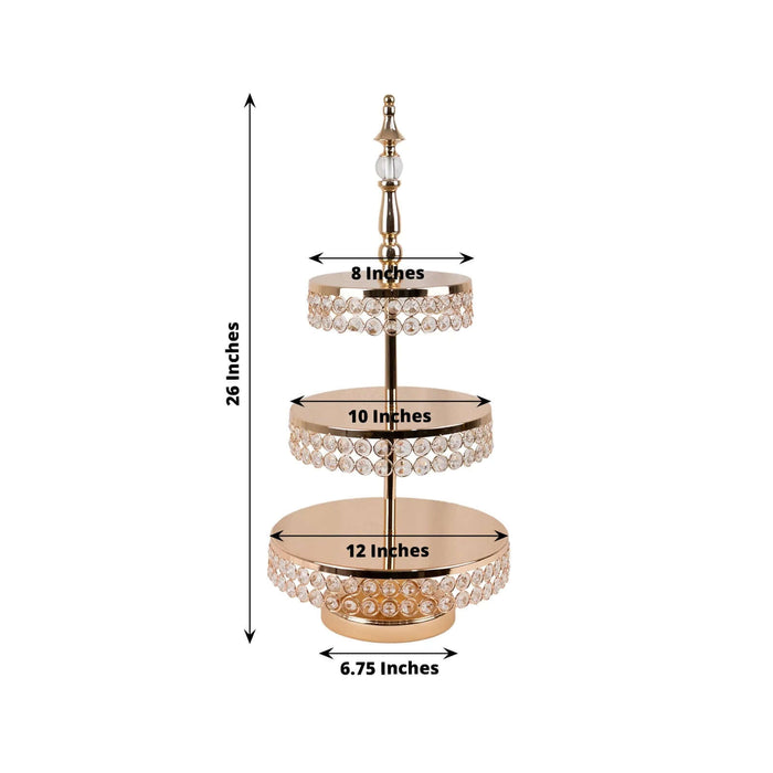 Gold three-tier cake stand with crystal accents, 26 inches tall.