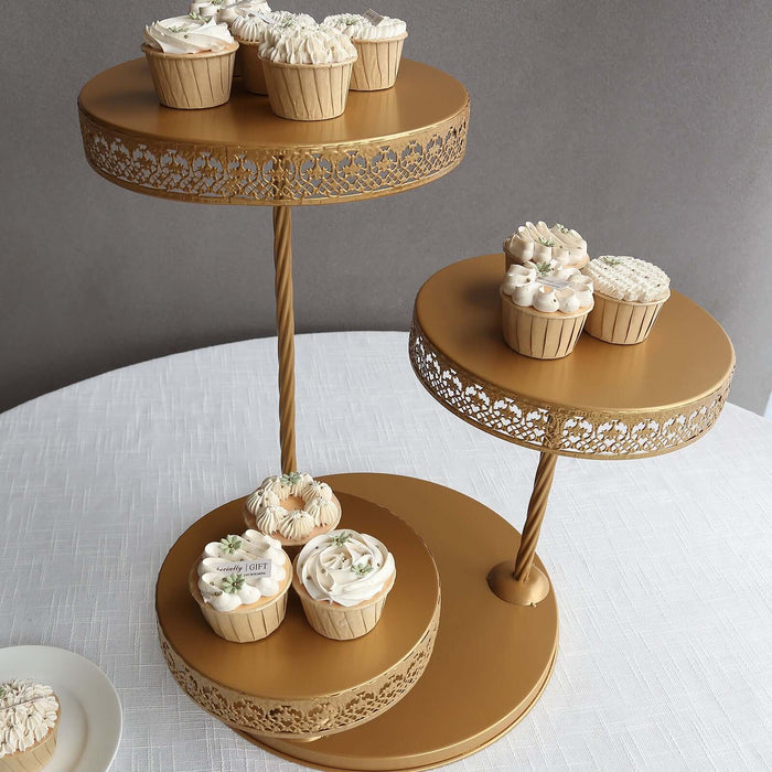 Gold cupcake stand with decorated cupcakes on a table.