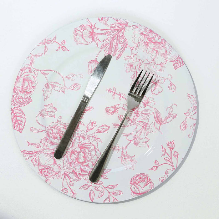 Floral dinner plate with knife and fork on a white background