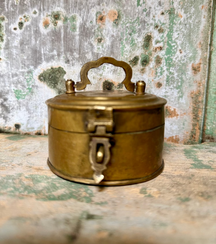 Vintage brass box with domed lid, side latch and arched carrying handle