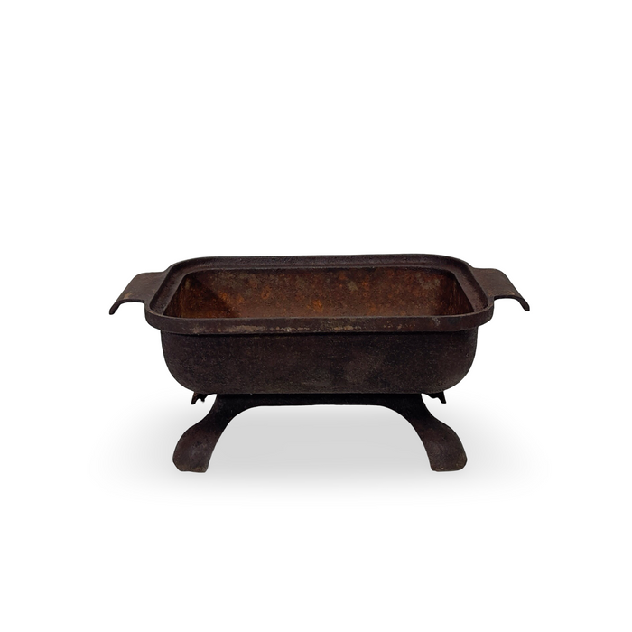 Antique cast iron basin with handles and tripod legs, rectangular rim