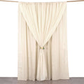 Cream curtain draped elegantly with a floral tieback on a white backdrop