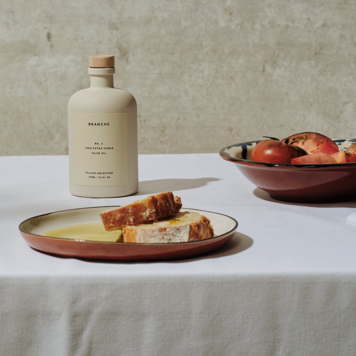 Branche No 2 extra virgin olive oil bottle with cork stopper on table