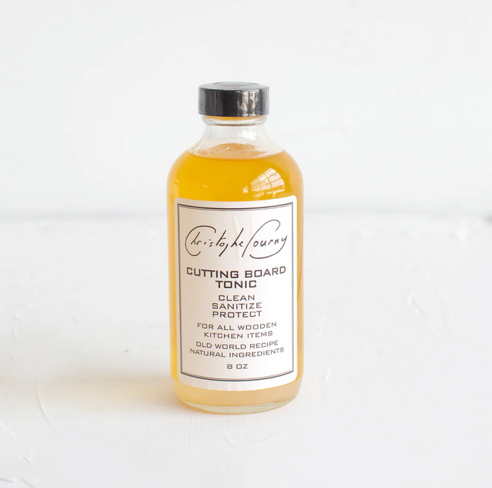 Amber glass tonic bottle with silver cap and white label