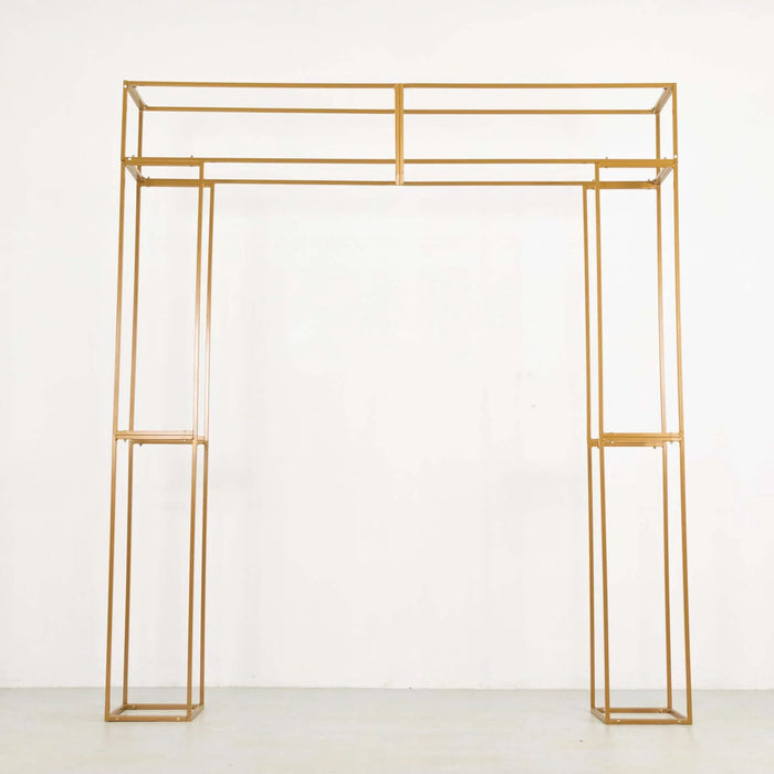 Gold metal display arch frame on a plain background