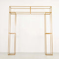 Gold metal display arch frame on a plain background