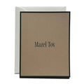 Mazel Tov greeting card with beige front, dark border, and centered title text