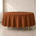 Cinnamon brown round tablecloth, durable and stain-resistant for easy maintenance.