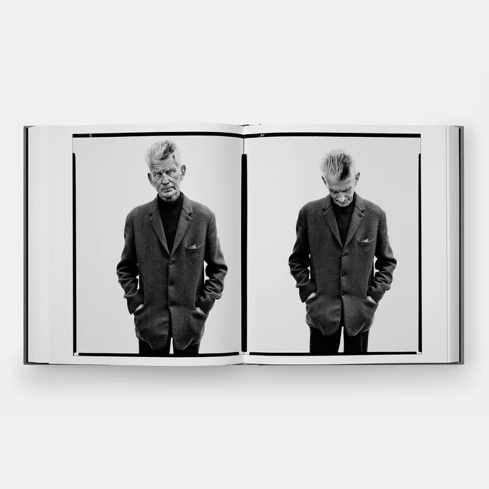 Open hardcover photo book spread with two black-and-white suit portraits