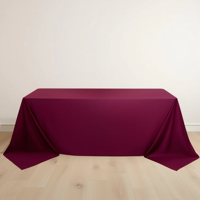 Burgundy tablecloth draped over a rectangular table