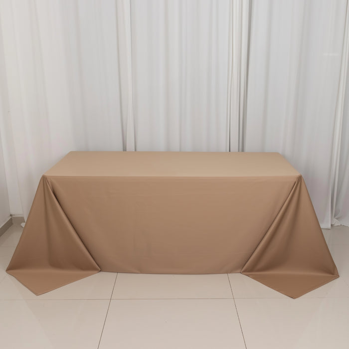 Brown tablecloth draped over a table in a studio setting.