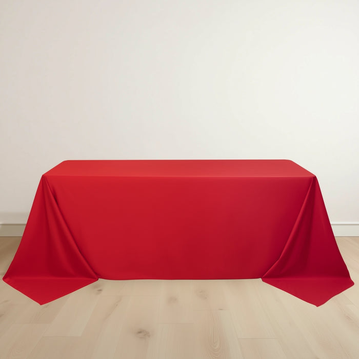 Red tablecloth draped over a table on a plain background