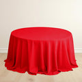 Red round table with elegant draping fabric.