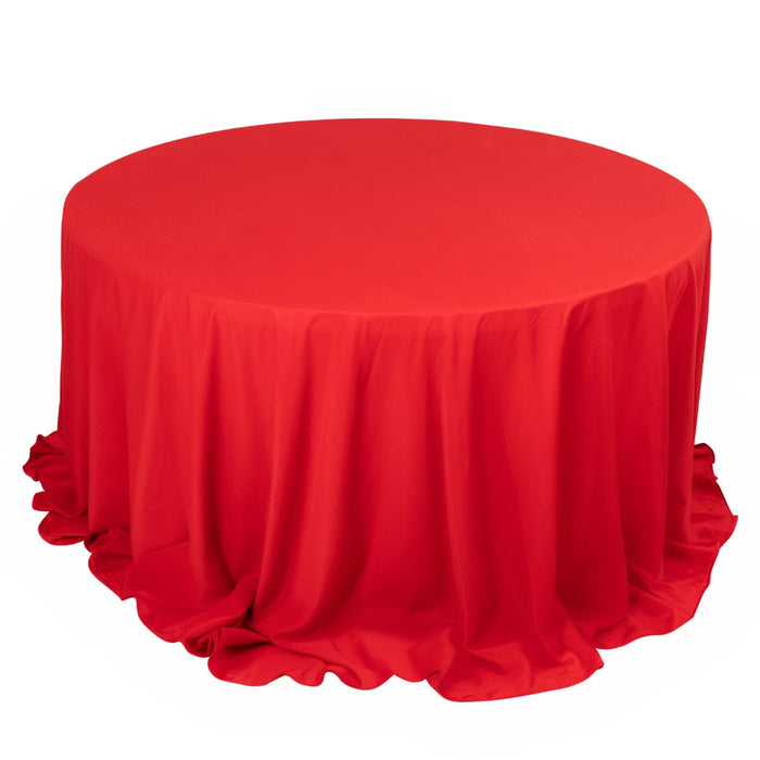 Red round tablecloth with elegant draping fabric.