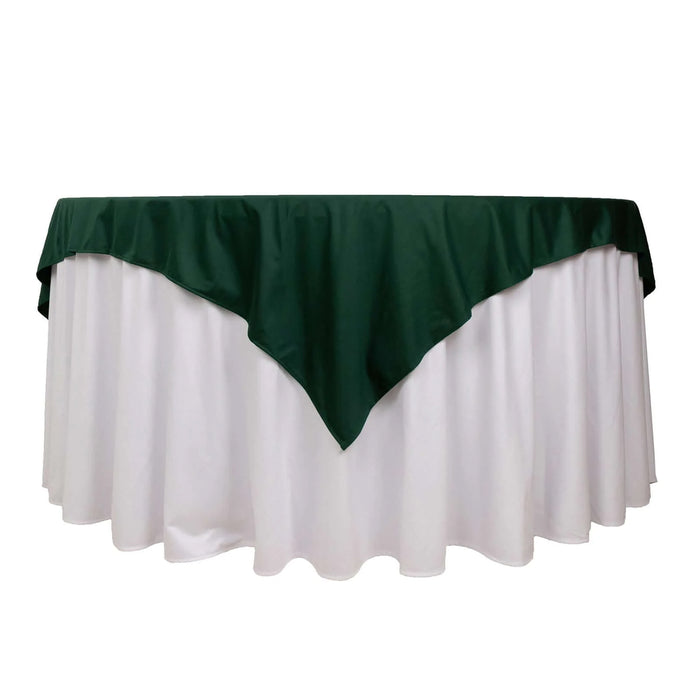 Green tablecloth overlay on white table, perfect for events and gatherings.