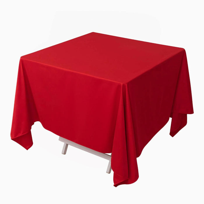 Red square tablecloth on a plain backdrop