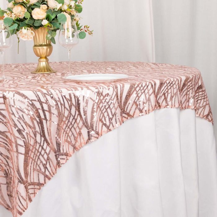 Rose gold sequined tablecloth draped elegantly over a white table.