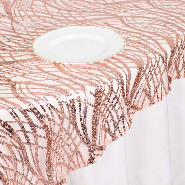 Rose gold sequin tablecloth with intricate design and elegant plate.