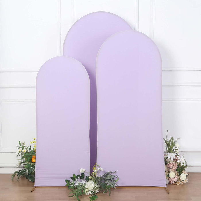Three lavender fabric backdrops of varying heights with floral accents.