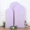 Three lavender fabric backdrops of varying heights with floral accents.