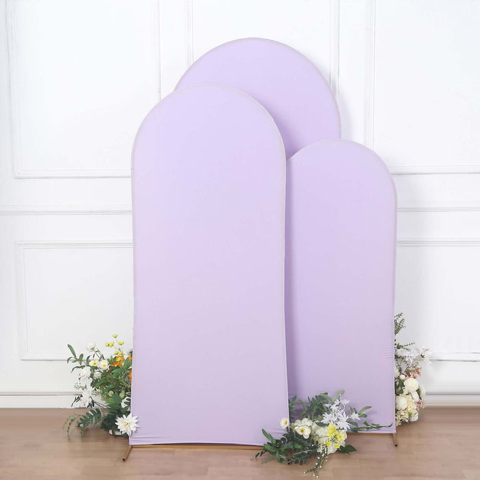 Set of three purple fabric backdrops with floral accents.