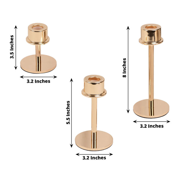 Gold candle holders in three sizes, 3.5", 5.5", and 8" tall.
