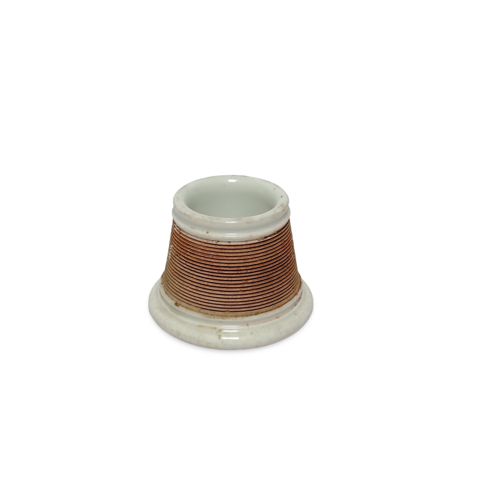 Ceramic match striker base with brown stripe wrap and shallow white foot