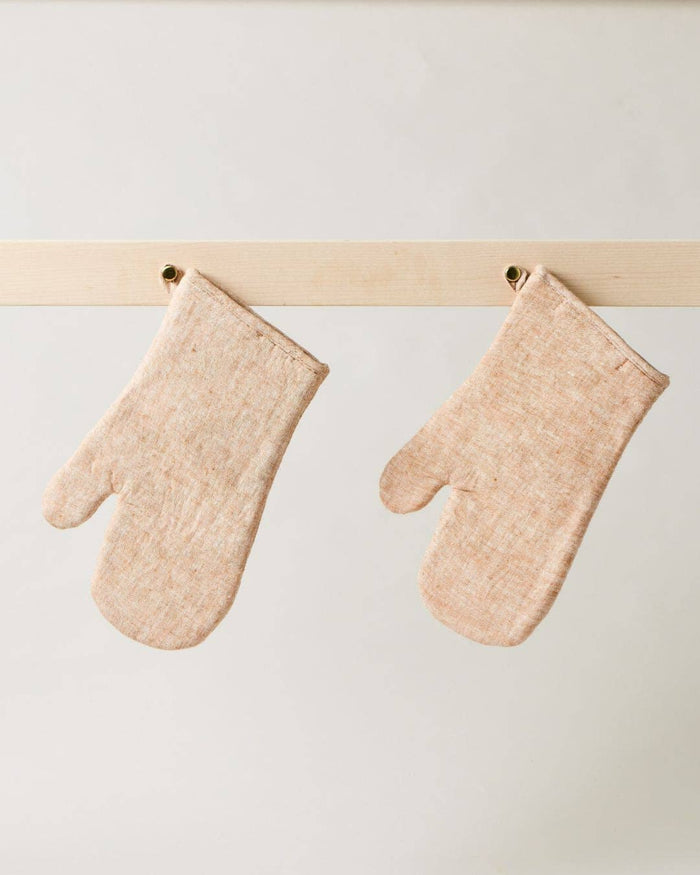 Light tan washed linen oven mitt with thumb and stitched cuff
